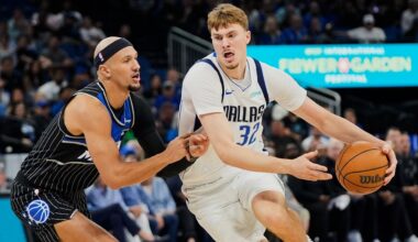 Dallas Mavericks forward Cooper Flagg (32) drives past Orlando Magic guard Jalen Suggs, left, during the first half of an NBA basketball game, Thursday, March 5, 2026, in Orlando, Fla. (AP Photo/John Raoux)