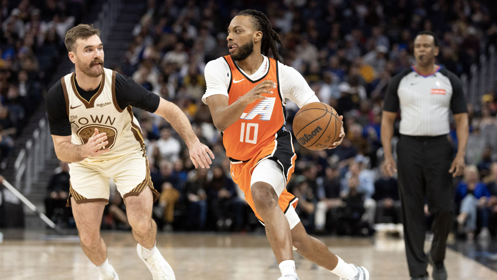 Los Angeles Clippers guard Darius Garland (10) drives past Golden State Warriors guard Pat Spencer (61) during the third quarter at Chase Center.