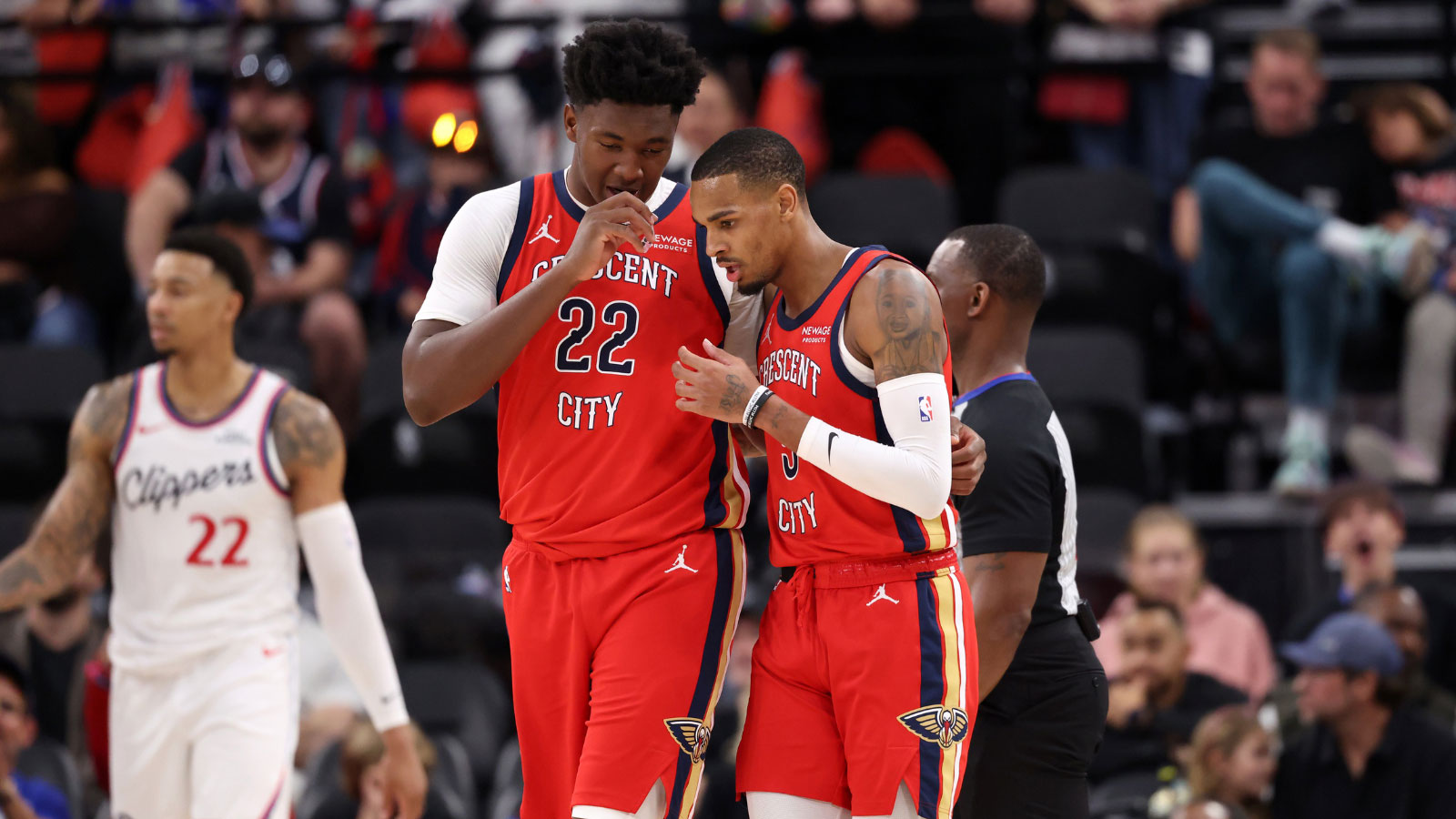 New Orleans Pelicans center Derik Queen (22) and guard Dejounte Murray (5) talk during the first half against the Los Angeles Clippers at Intuit Dome. 