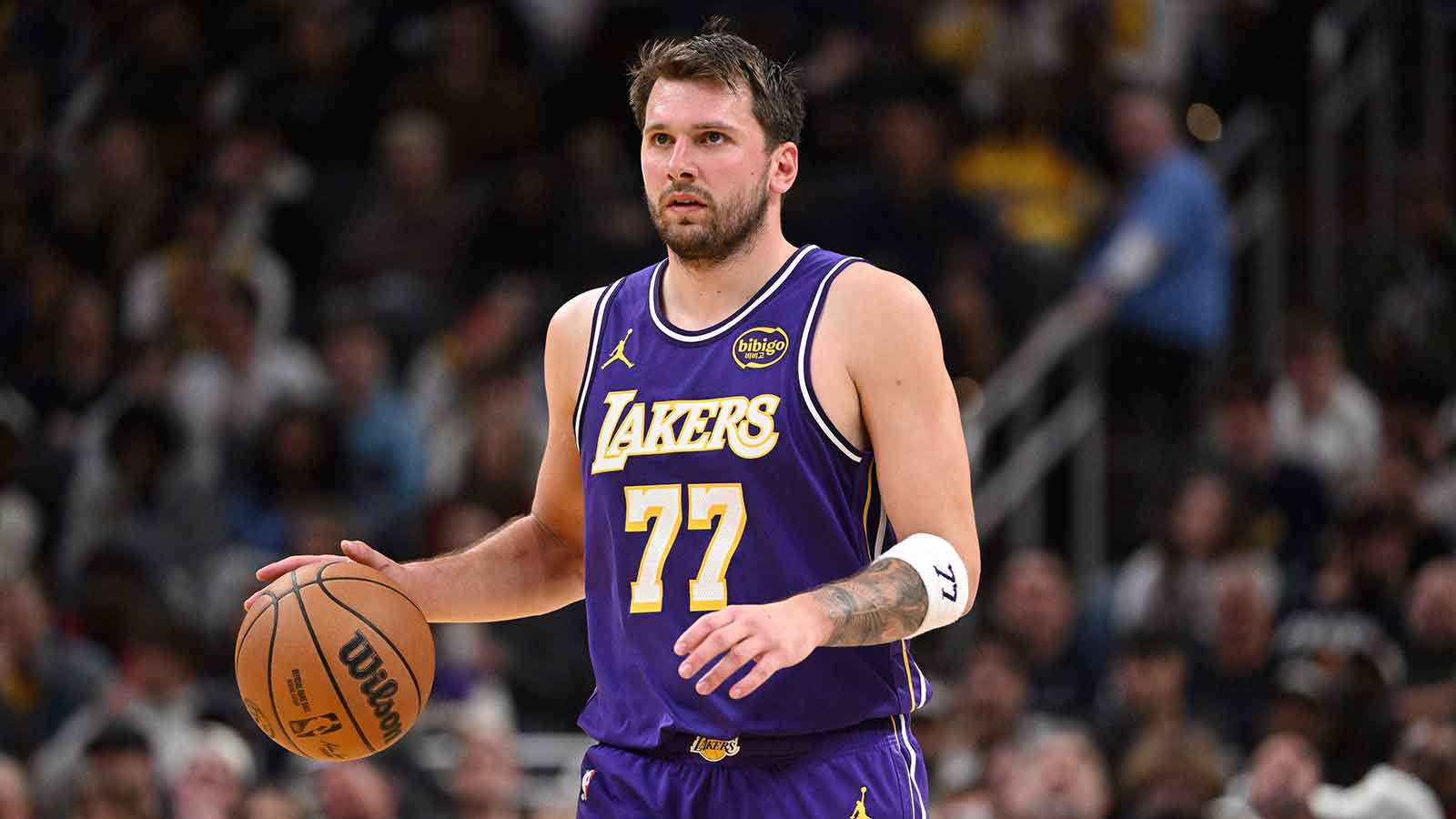 Los Angeles Lakers guard Luka Doncic (77) dribbles the ball down court during the second half against the Indiana Pacers at Gainbridge Fieldhouse.