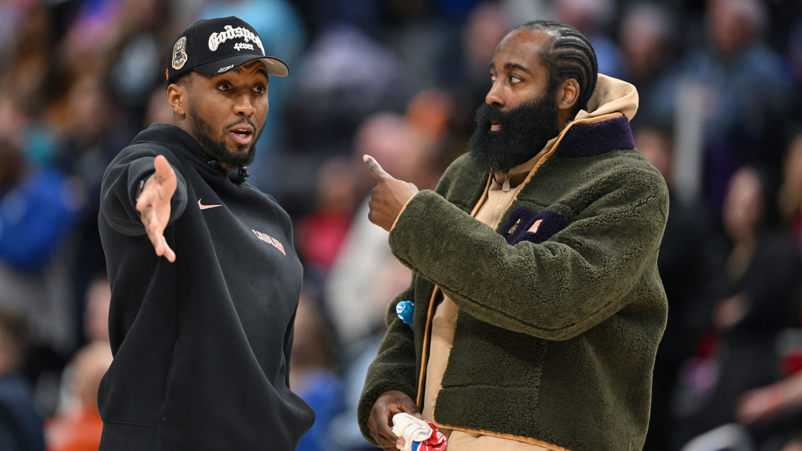 Cleveland Cavaliers guard Donovan Mitchell (left) talks with teammate James Harden during a timeout against the Detroit Pistons in the second half at Little Caesars Arena. Neither played in their overtime loss to the Pistons.