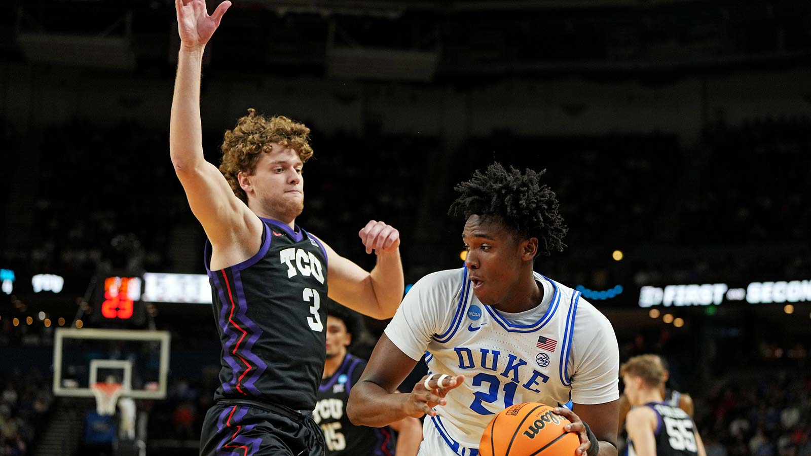 Patrick Ngongba II appears in a boot after Duke basketball beats TCU in March Madness as the Blue Devils advance to the Sweet 16.