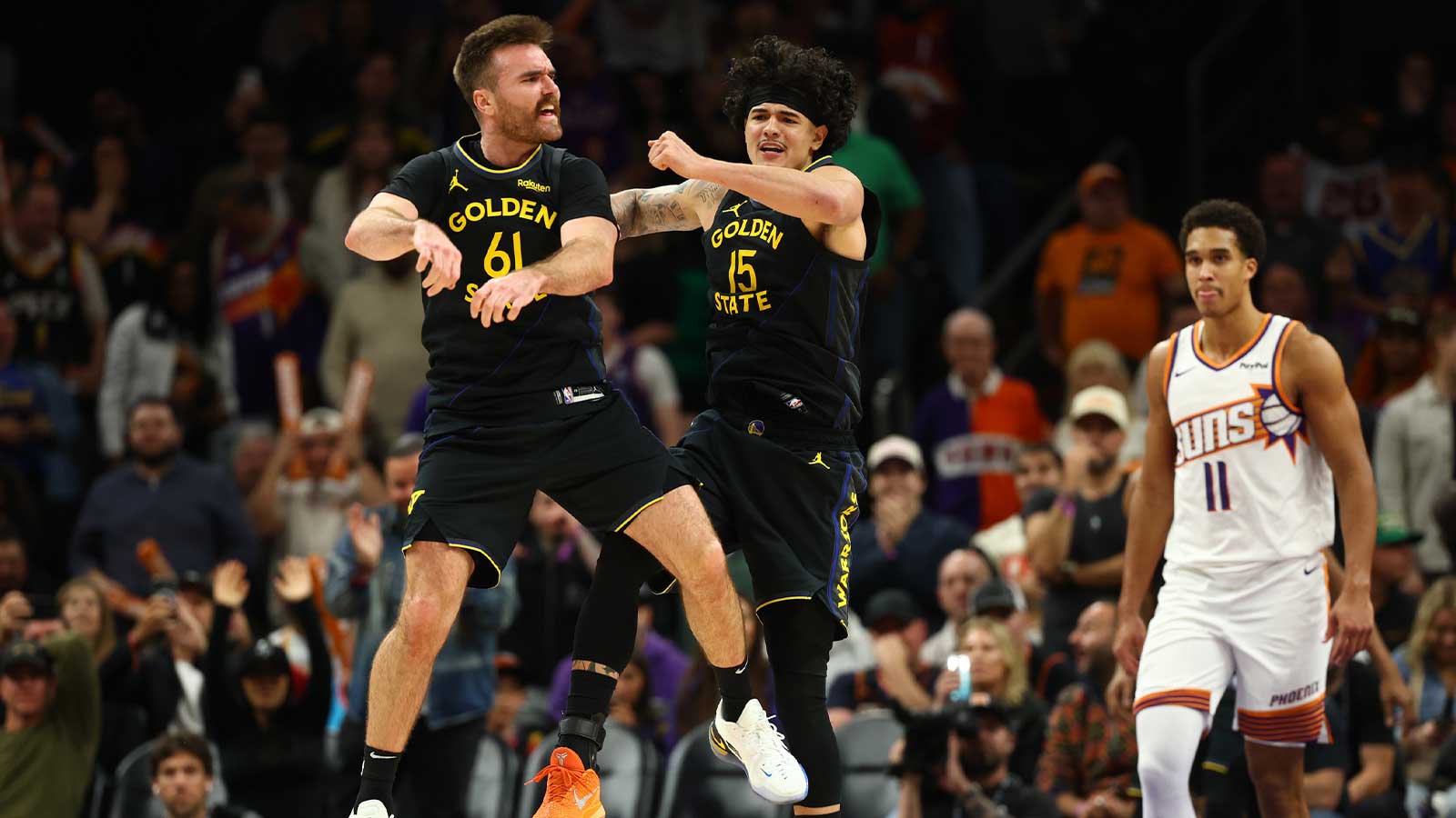 Golden State Warriors guard Pat Spencer (61) celebrates with forward Gui Santos (15) against the Phoenix Suns in the second half at Mortgage Matchup Center.