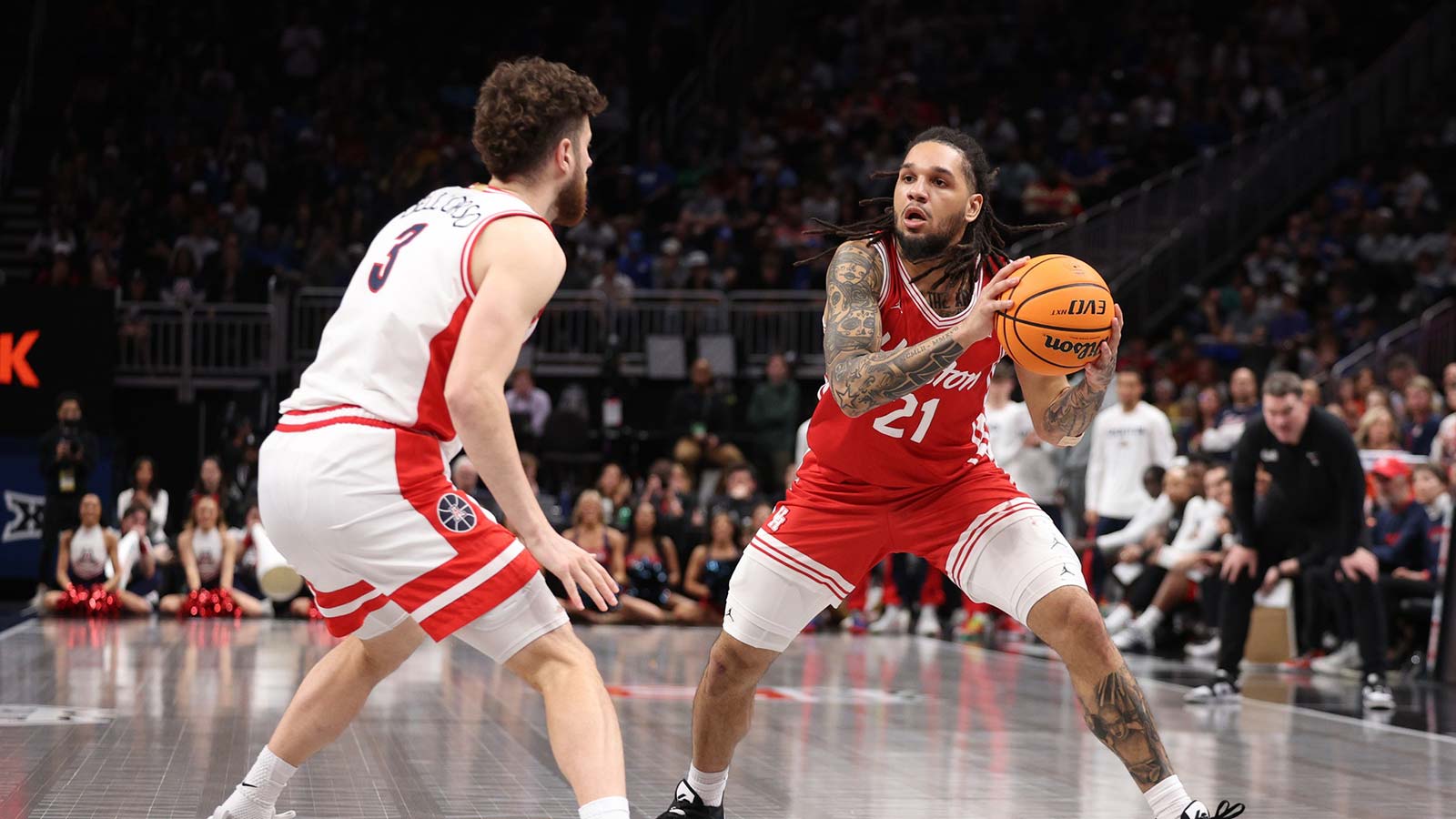 Houston Cougars guard Emanuel Sharp (21) drives to the hoop past Arizona Wildcats guard Anthony Dell'orso (3) during the second half during the men's Big 12 Conference Tournament Championship at T-Mobile Center.