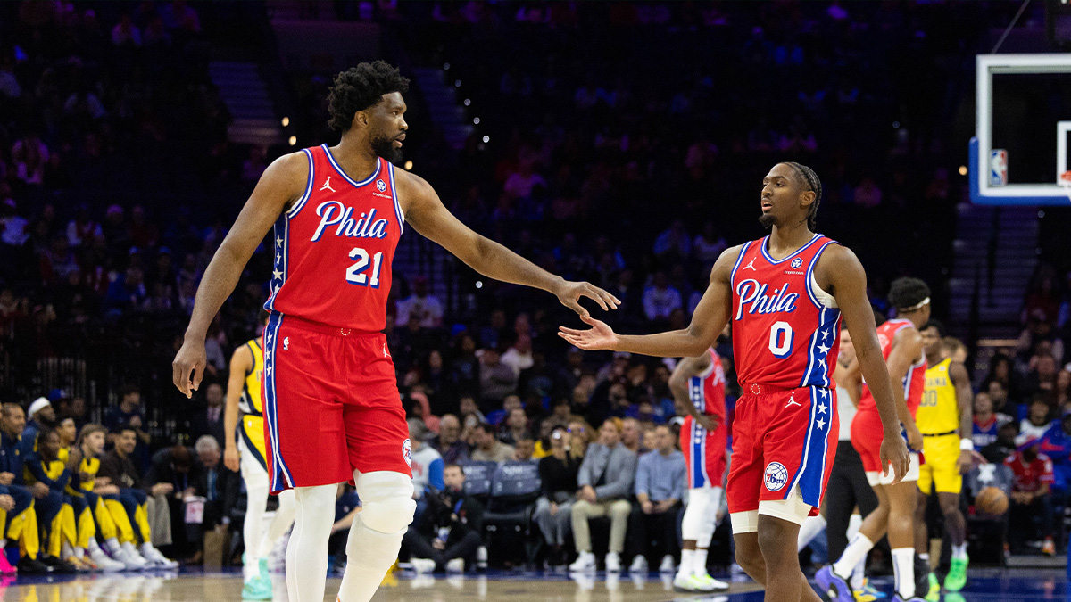 Philadelphia 76ers center Joel Embiid (21) and guard Tyrese Maxey (0) slap hands after a play against the Indiana Pacers during the first quarter at Wells Fargo Center.