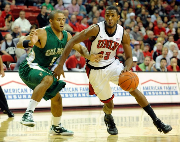 Mike Moser of the UNLV Rebels brings the ball up the court against Jordan Lewis of the Cal Poly Mustangs during their game at the Thomas & Mack Center on Nov. 22, 2011 in Las Vegas, Nevada. (Photo by Ethan Miller/Getty Images)