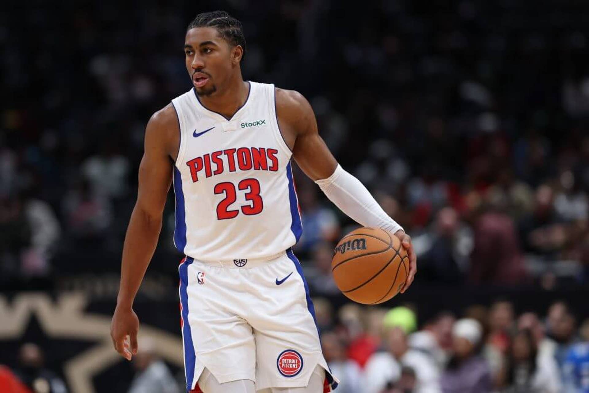 An image of NBA guard Jaden Ivey dribbling a basketball with his left hand during a game with the Detroit Pistons last November.