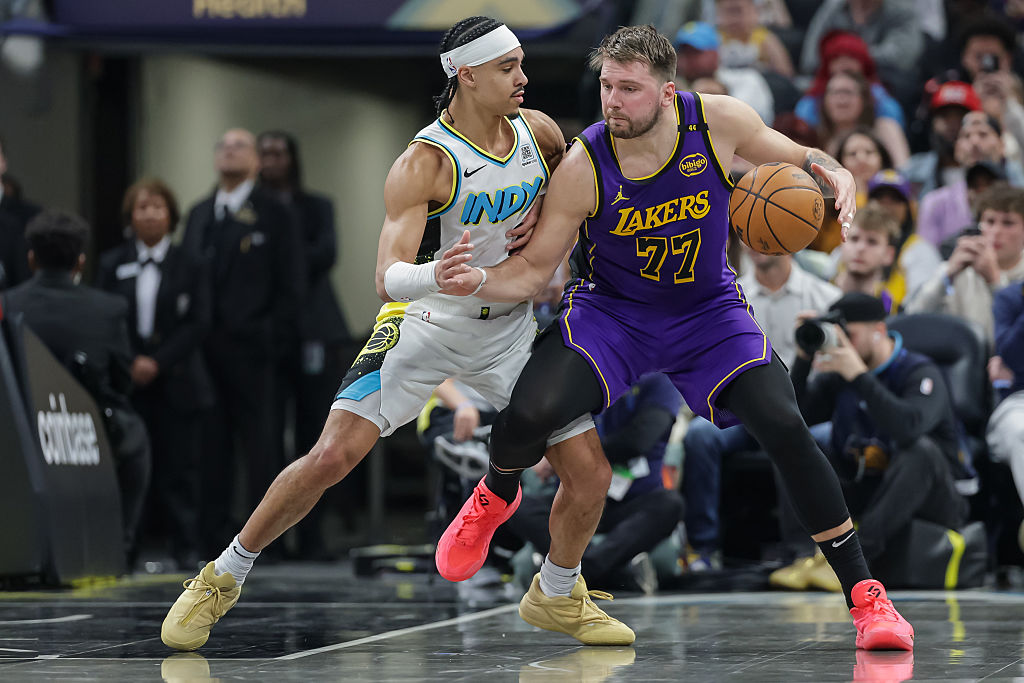 INDIANAPOLIS, INDIANA - MARCH 26: Luka Doncic #77 of the Los Angeles Lakers dribbles against Andrew Nembhard #2 of the Indiana Pacers at Gainbridge Fieldhouse on March 26, 2025 in Indianapolis, Indiana. NOTE TO USER: User expressly acknowledges and agrees that, by downloading and or using this photograph, User is consenting to the terms and conditions of the Getty Images License Agreement. (Photo by Michael Hickey/Getty Images)
