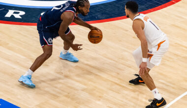 Phoenix Suns guard Devin Booker guards Los Angeles Clippers forward Kawhi Leonard
