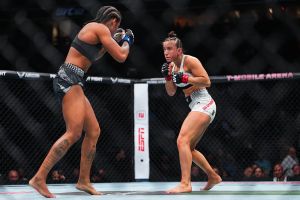 LAS VEGAS, NEVADA - DECEMBER 06: Maycee Barber battles Karine Silva of Brazil in their women's flyweight fight during the UFC 323 event at T-Mobile Arena on December 06, 2025 in Las Vegas, Nevada. (Photo by Cooper Neill/Zuffa LLC)