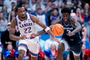 LAWRENCE, KANSAS - JANUARY 31: Darryn Peterson #22 of the Kansas Jayhawks and forward AJ Dybantsa #3 of the BYU Cougars chase down a loose ball in the first half at Allen Fieldhouse on January 31, 2026 in Lawrence, Kansas. (Photo by Ed Zurga/Getty Images) 2026 NBA Draft