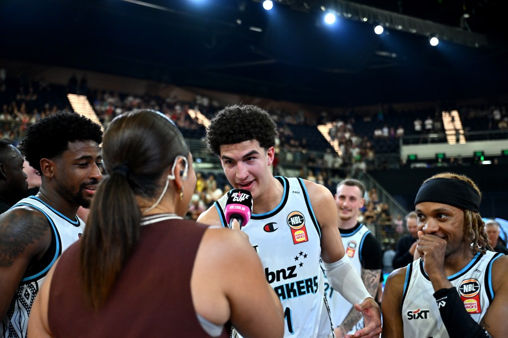 Karim Lopez of the Breakers is interviewed by Ariana Prather after their NBL Ignite Cup Final victory.