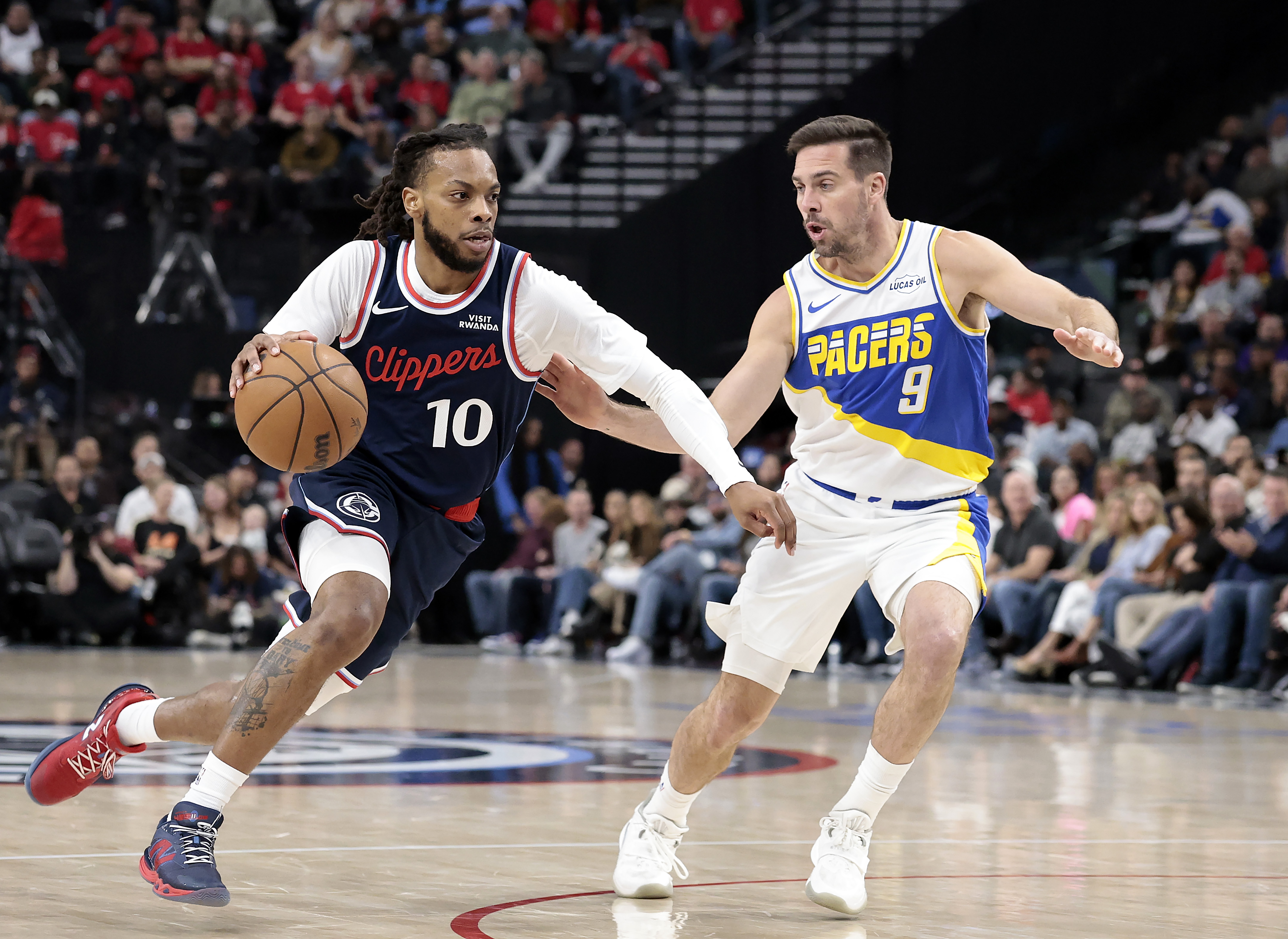 Clippers point guard Darius Garland drives as the Indiana Pacers’...