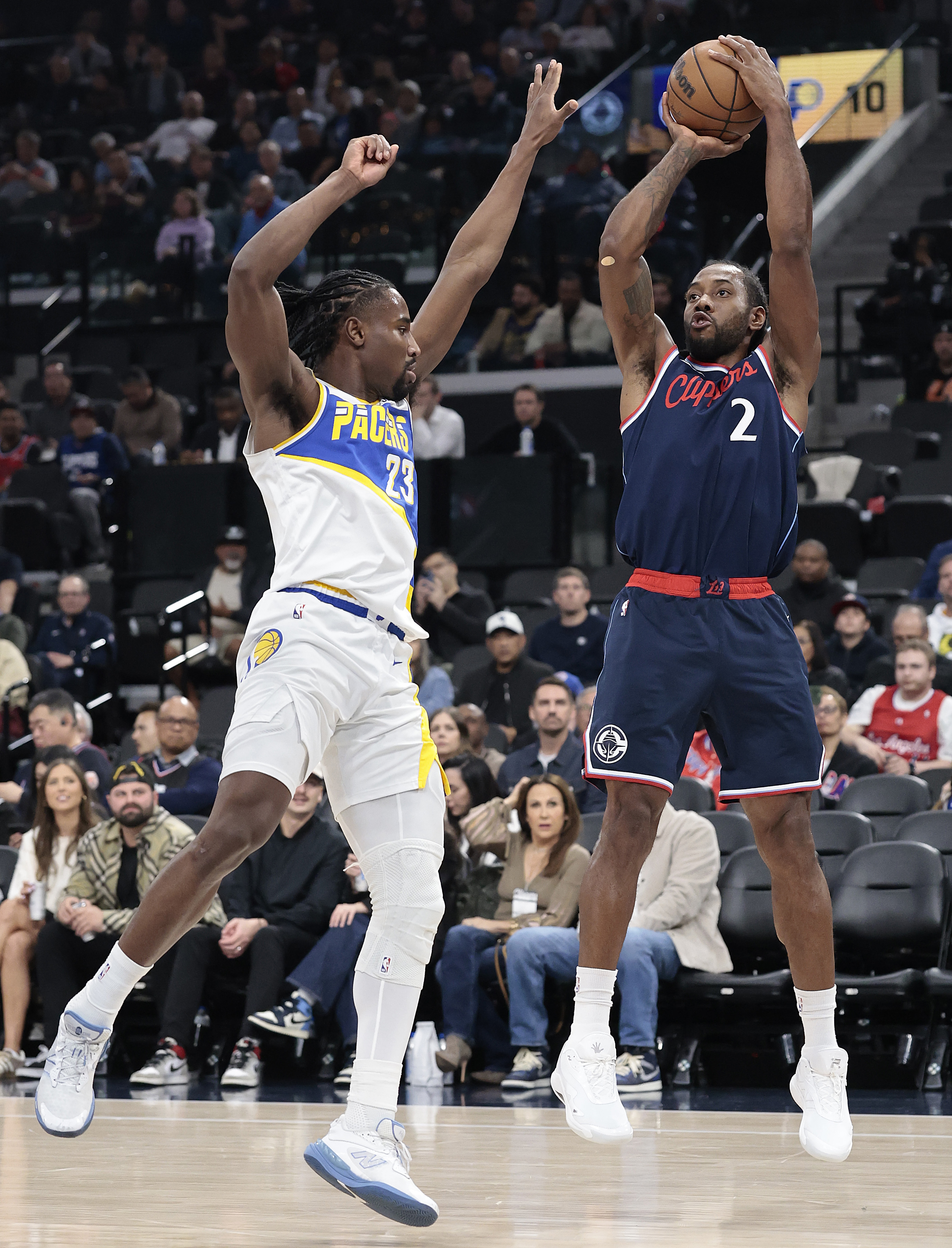 Clippers star Kawhi Leonard takes a shot as the Indiana...