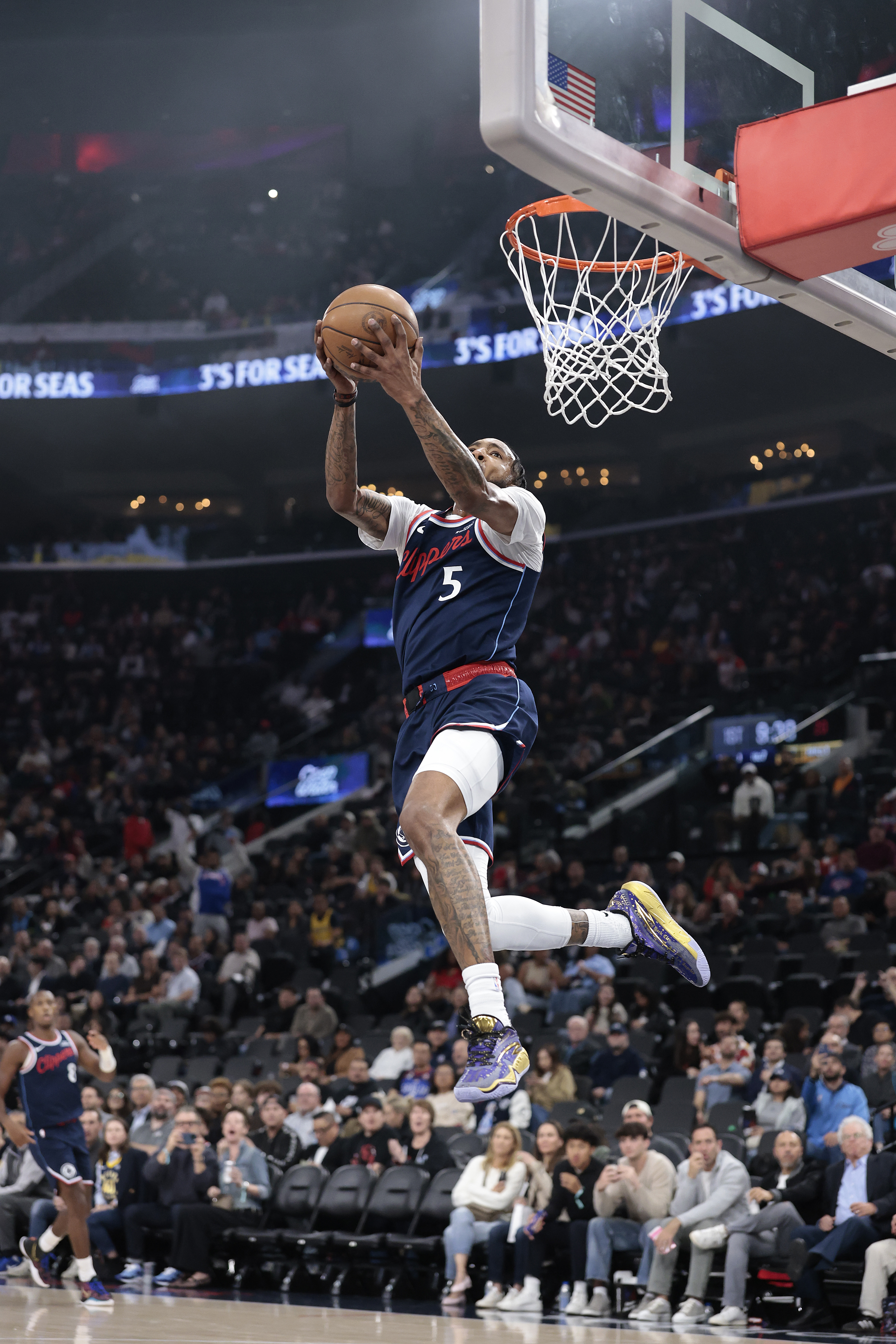 Clippers forward Derrick Jones Jr. soars to the rim for...