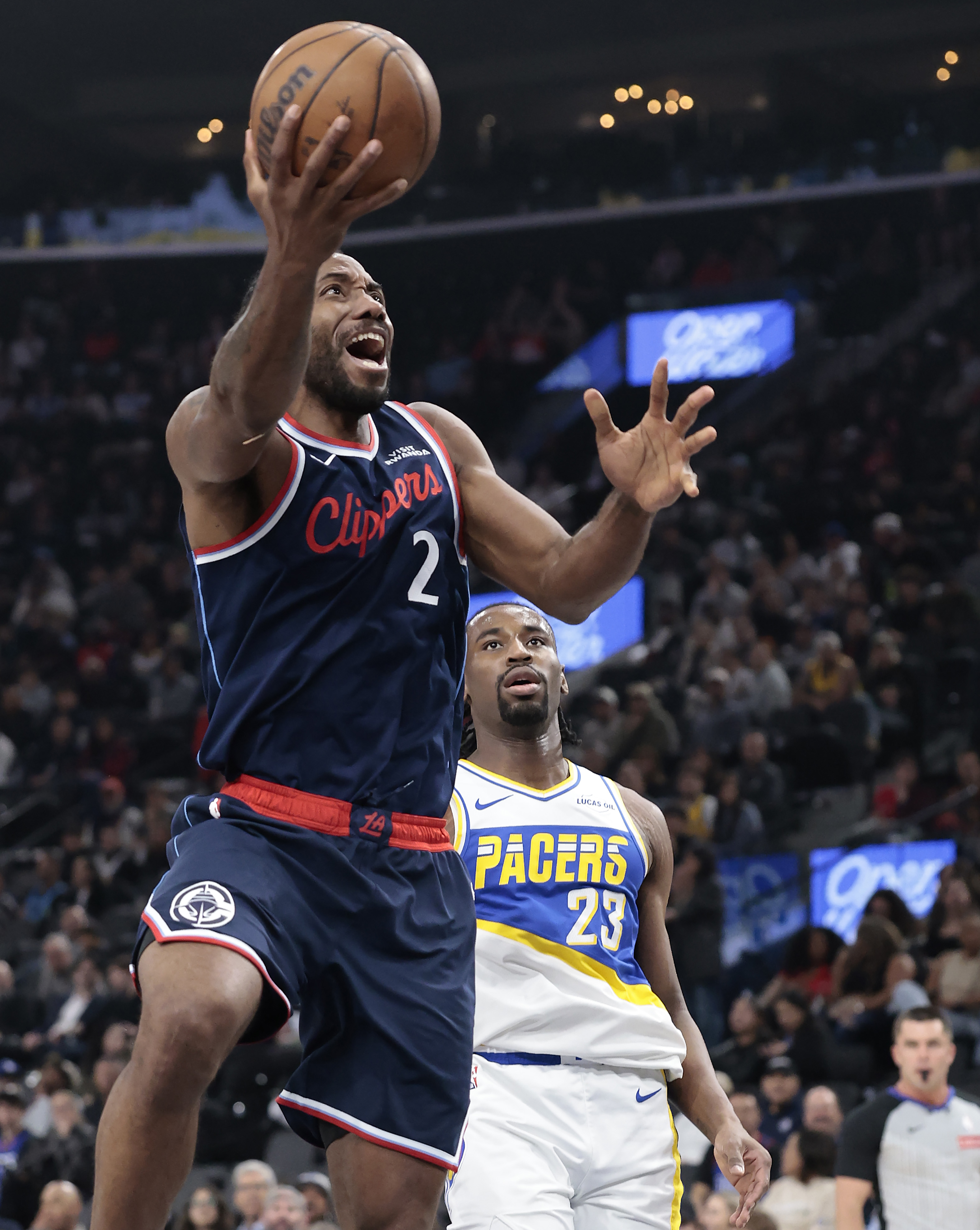 Clippers star Kawhi Leonard takes a shot in front of...