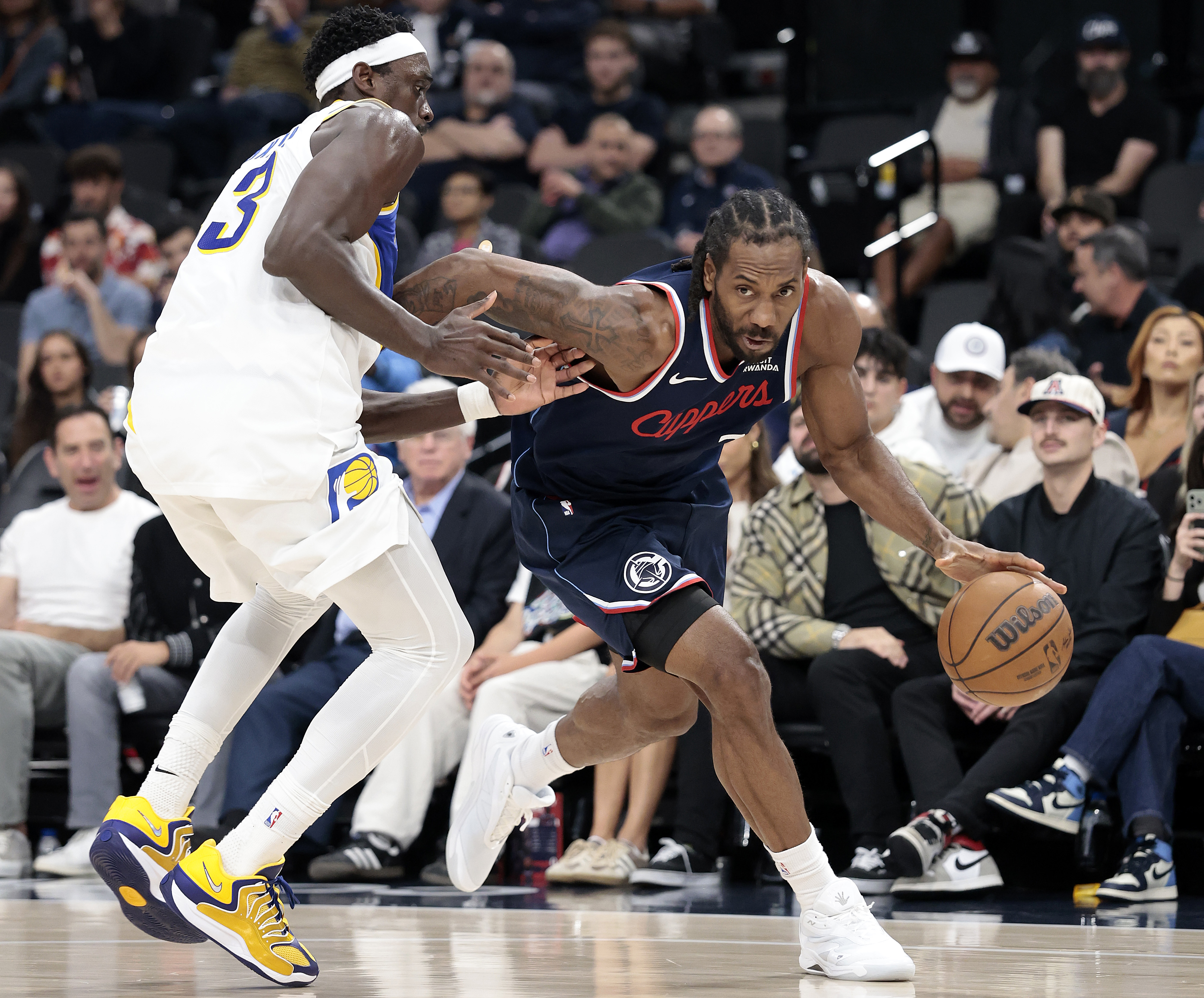 Clippers star Kawhi Leonard handles the ball as Indiana Pacers...