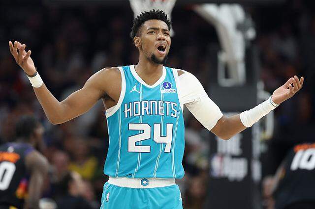 Brandon Miller of the Charlotte Hornets reacts to a foul call during the first half of the NBA game against the Phoenix Suns at Mortgage Matchup Center.