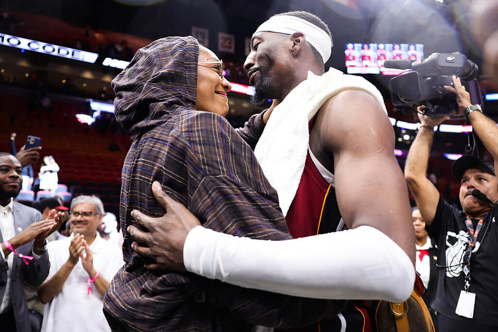Bam Adebayo embraces his girlfriend, WNBA MVP A'ja Wilson, after his 83-point game.