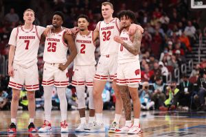 CHICAGO, ILLINOIS - MARCH 12: Andrew Rohde #7, John Blackwell #25, Nick Boyd #2, Aleksas Bieliauskas #32 and Braeden Carrington #0 of the Wisconsin Badgers look on against the Washington Huskies in the first half during the third round of the 2026 Big Ten Men's Basketball Tournament at the United Center on March 12, 2026 in Chicago, Illinois. (Photo by Michael Reaves/Getty Images)
