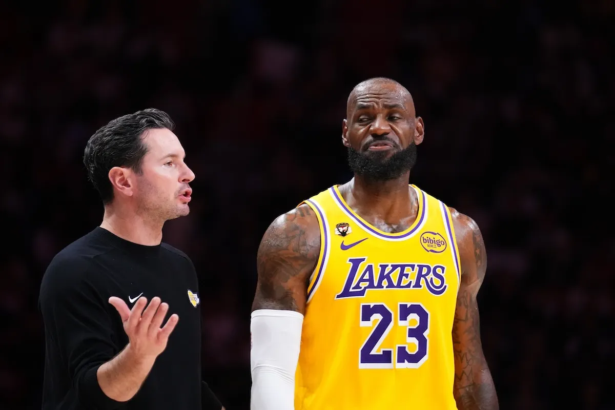 Lakers coach JJ Redick talks to LeBron James during Miami Heat game