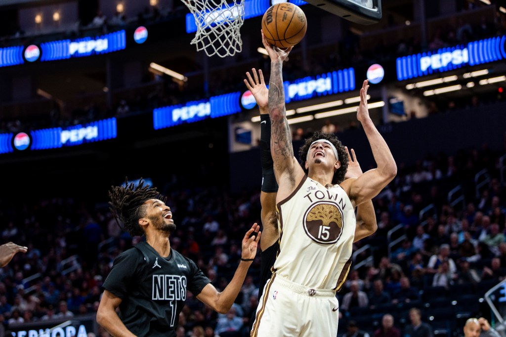 Gui Santos, who scored a game-high 31 points, goes up for a layup as Ziaire Williams looks on during the Nets' 109-106 loss to the Warriors on March 25, 2026 in San Francisco.