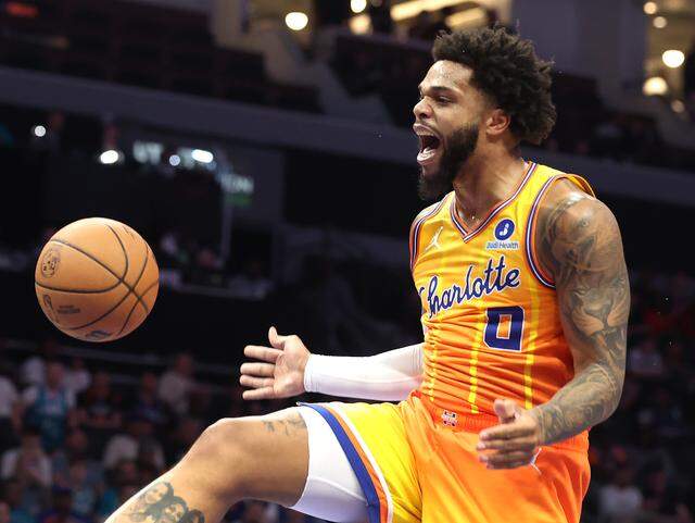Charlotte Hornets forward Miles Bridges screams as he finishes off a two-handed dunk against the New York Knicks at Spectrum Center in Charlotte, North Carolina, on Thursday, March 26, 2026. 