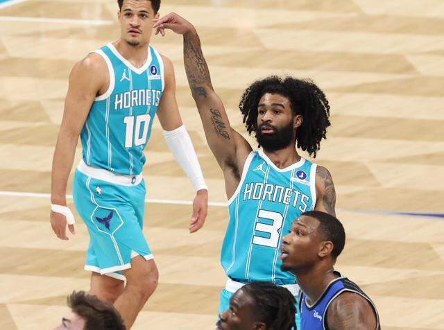 Charlotte Hornets guard Coby White holds his release on a free throw during Thursday’s action against the Orlando Magic at Spectrum Center.