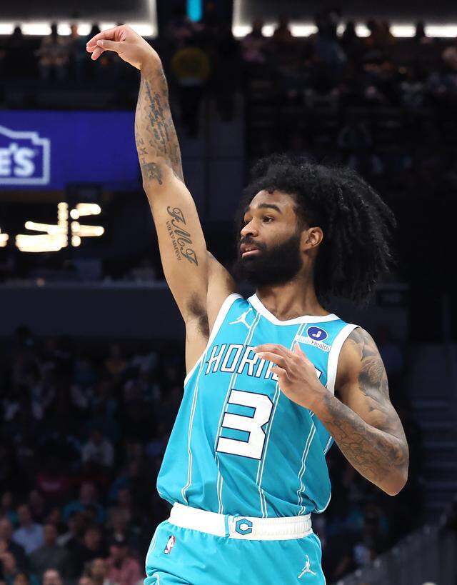 Charlotte Hornets guard Coby White takes a 3-point shot attempt during Thursday’s action against the Orlando Magic at Spectrum Center.