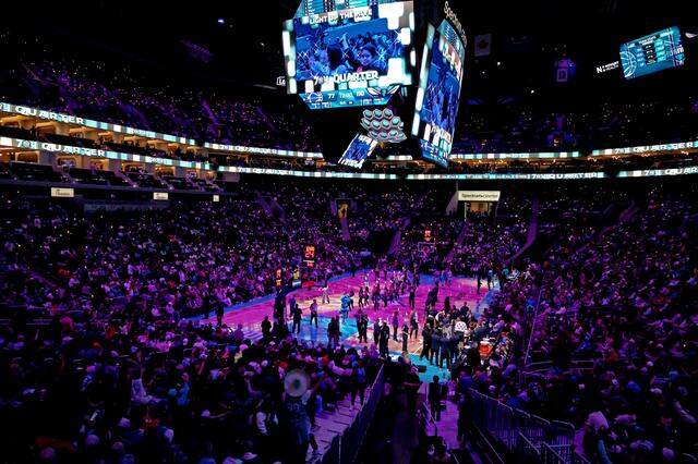 Charlotte Hornets fans Light Up the Hive as the team prepares to open up the fourth quarter against the Orlando Magic at Spectrum Center on  March 19. The Hornets defeated the Magic, 130-111.