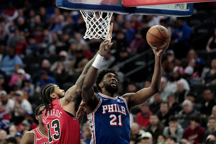Sixers # 21 Joel Embiid battles Chicago’s # 13 Nick Richards in the first half of the Chicago Bulls at Philadelphia 76ers (Sixers) NBA game at Xfinity Mobile Arena in Philadelphia on Wednesday, March 25, 2026.