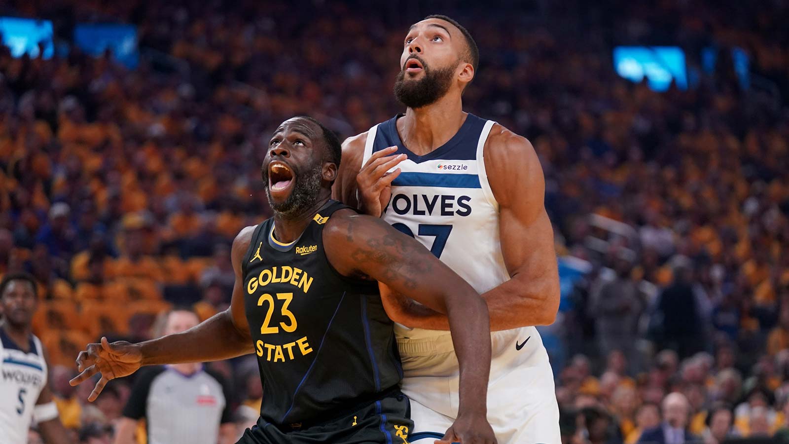 Golden State Warriors forward Draymond Green (23) battles for position with Minnesota Timberwolves center Rudy Gobert (27) in the first quarter during game four of the second round for the 2025 NBA Playoffs at Chase Center.
