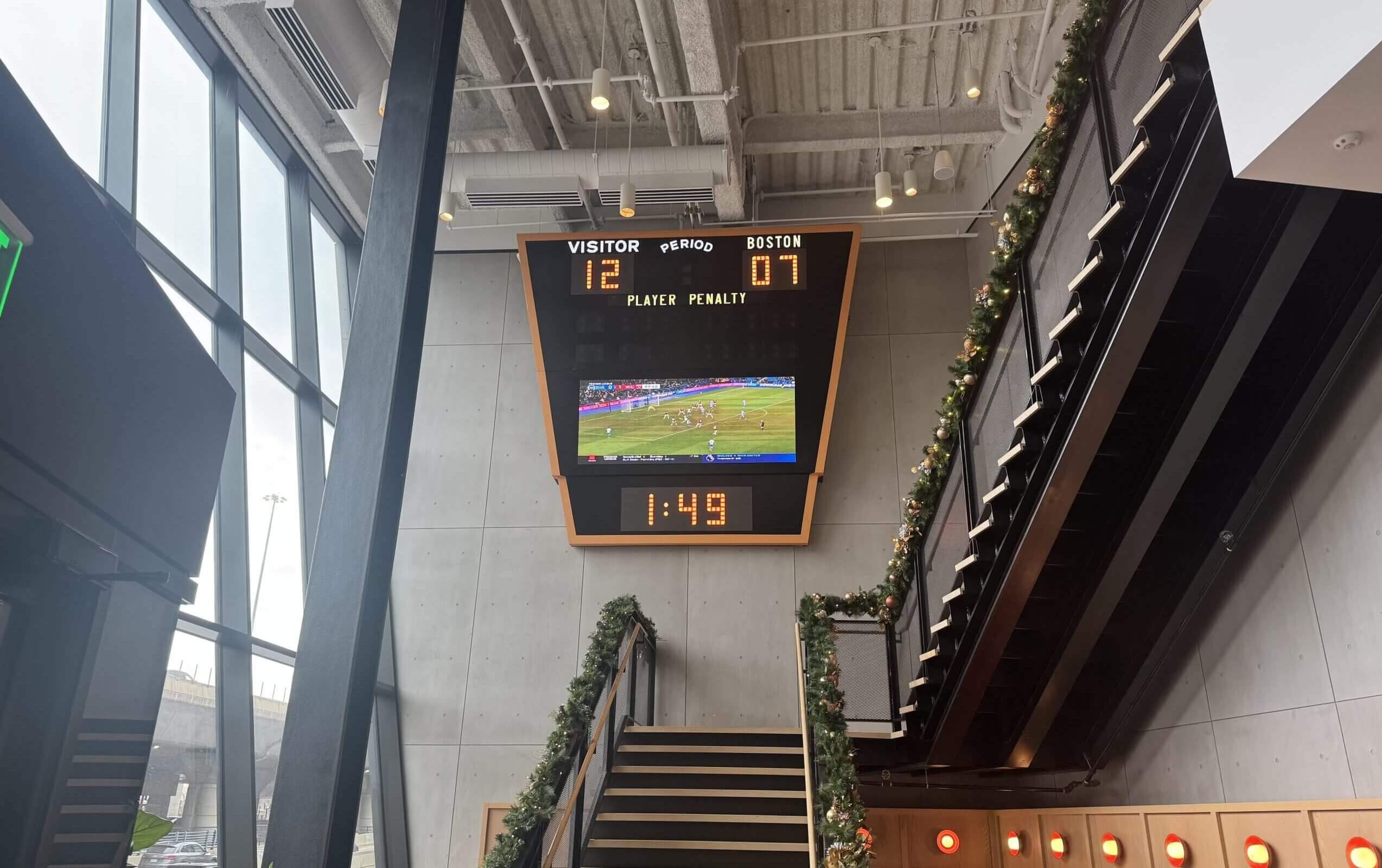 One of the old scoreboard's sides has been removed and rehabbed and will live happily ever after on a wall inside the Ink Block complex in Boston’s South End, where passersby can see it from outside. (Steve Buckley / The Athletic)