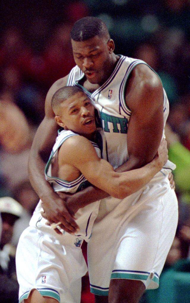 Muggsy Bogues (left) and Larry Johnson were one of the NBA's most popular pairings during their time together with the Charlotte Hornets in the mid-1990s.