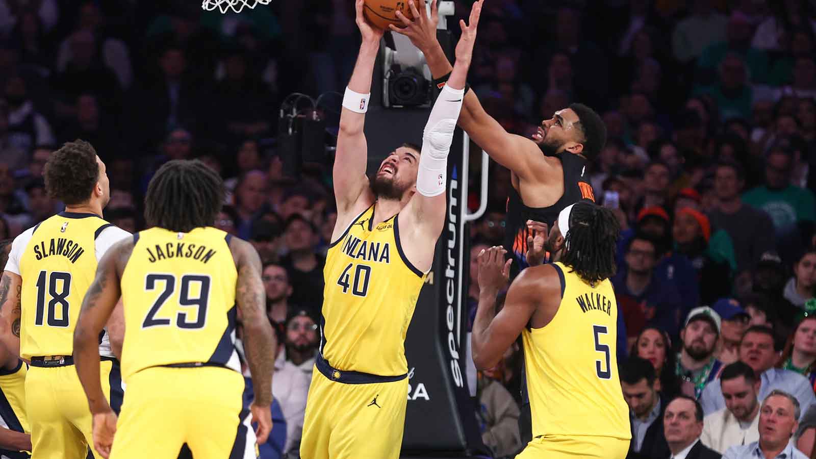 Indiana Pacers center Ivica Zubac (40) and New York Knicks center Karl-Anthony Towns (32) fight for a rebound in the second quarter at Madison Square Garden. Mandatory Credit: Wendell Cruz-Imagn Images