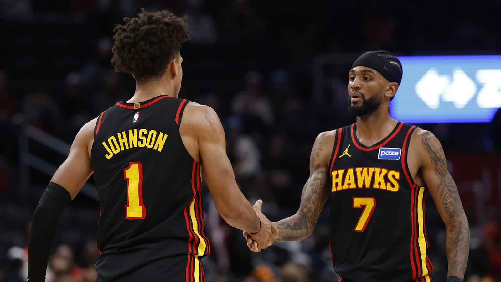 Atlanta Hawks forward Jalen Johnson (1) celebrates with Hawks guard Nickeil Alexander-Walker (7) after scoring while being fouled against the Washington Wizards in the second half at Capital One Arena.