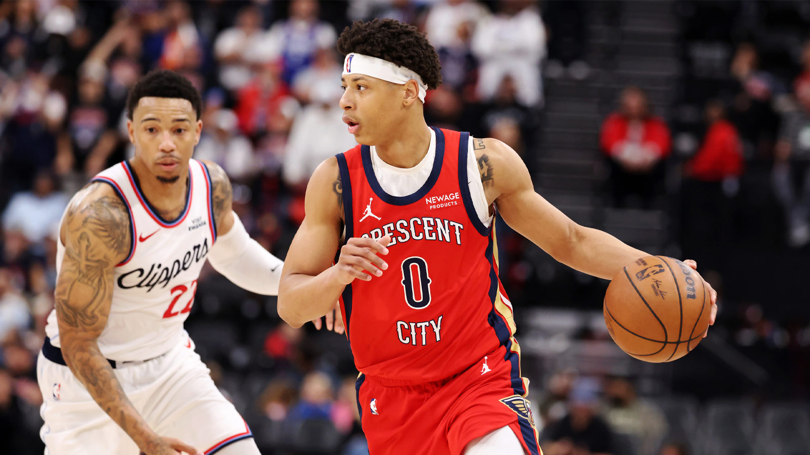 New Orleans Pelicans guard Jeremiah Fears (0) dribbles the ball against Los Angeles Clippers guard Jordan Miller (22) during the second half at Intuit Dome.