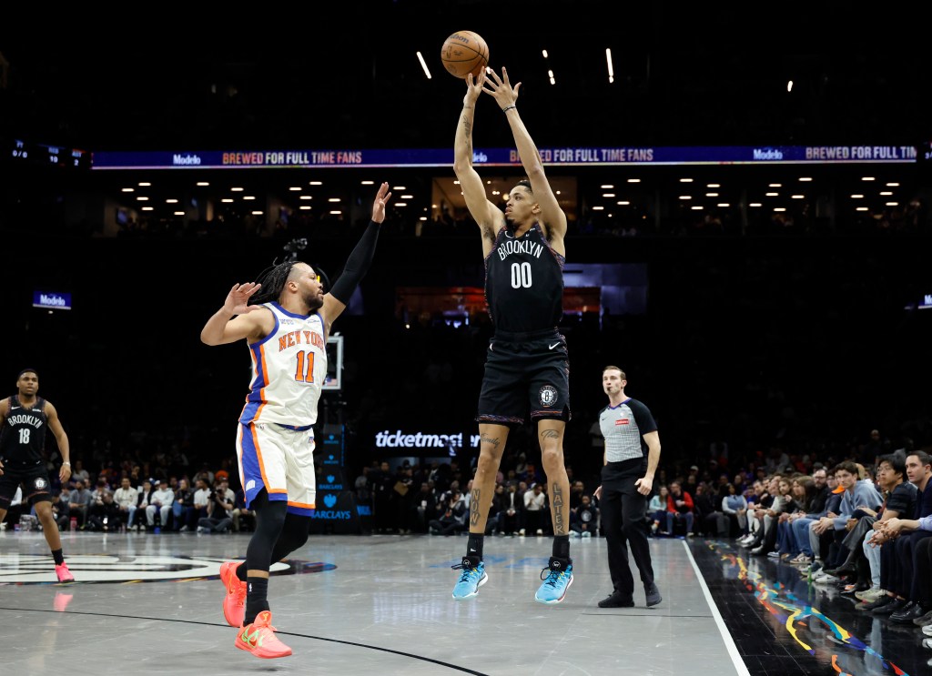Josh Minott, who scored 22 points off the bench, shoots a jumper over Jalen Brunson during the Nets' 93-92 loss to the Knicks on March 20, 2026 at Barclays Center.