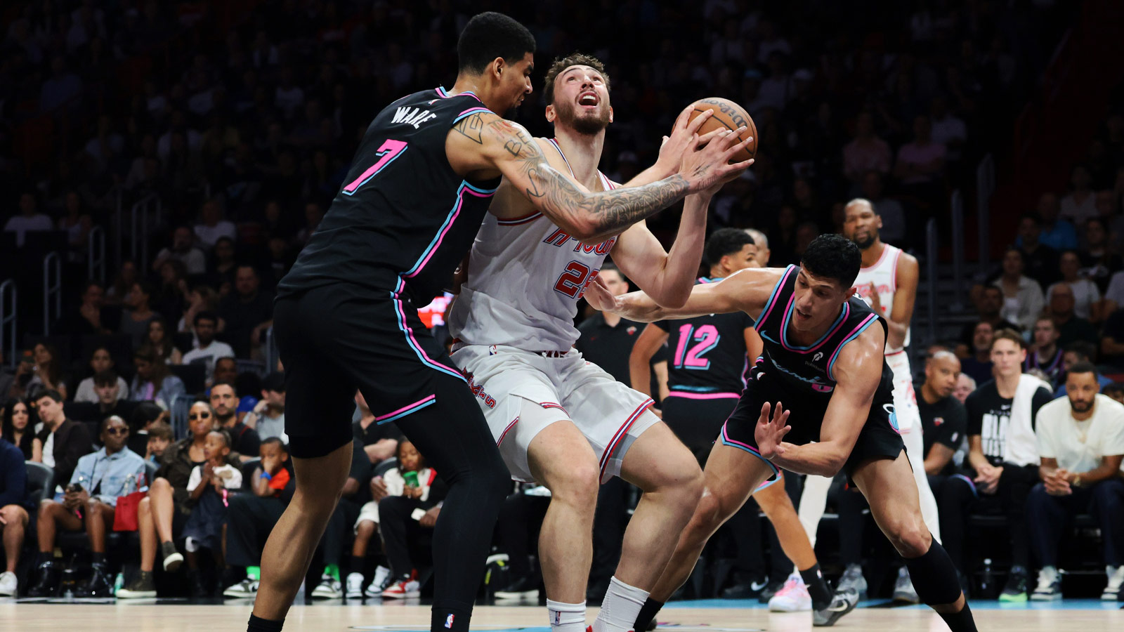 Houston Rockets center Alperen Sengun (28) drives to the basket against Miami Heat center Kel'el Ware (7) and forward Simone Fontecchio (0) during the second quarter at Kaseya Center.