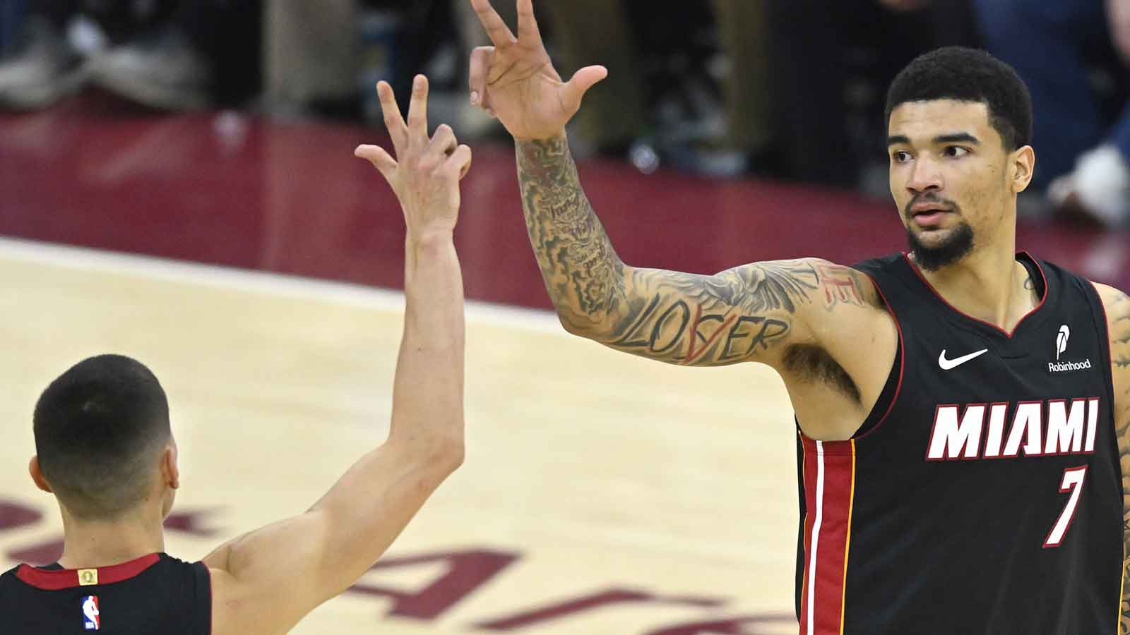 Miami Heat center Kel'el Ware (7) celebrates his three-point basket with guard Tyler Herro (14) in the fourth quarter against the Cleveland Cavaliers at Rocket Arena.