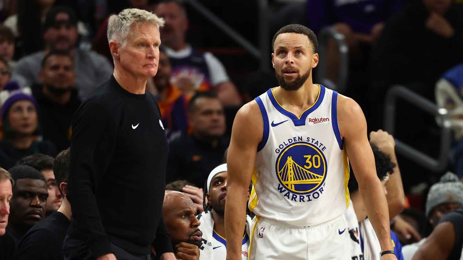 Warriors guard Stephen Curry (30) reacts alongside head coach Steve Kerr