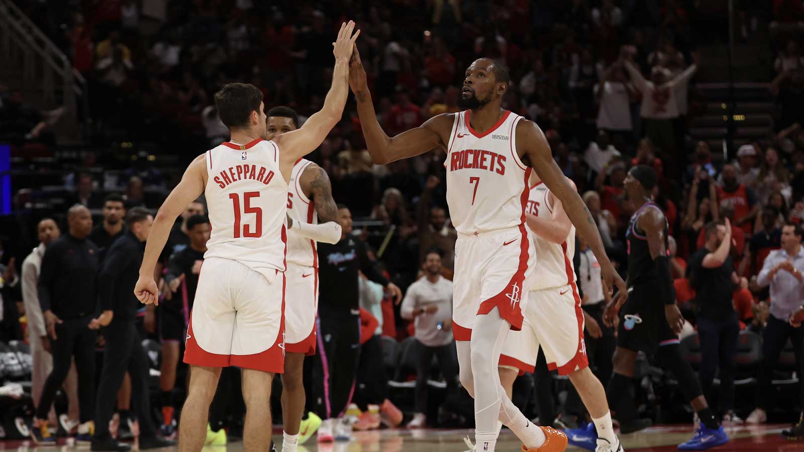 Houston Rockets forward Kevin Durant (7) reacts with guard Reed Sheppard (15) against the Miami Heat in the second half at Toyota Center.