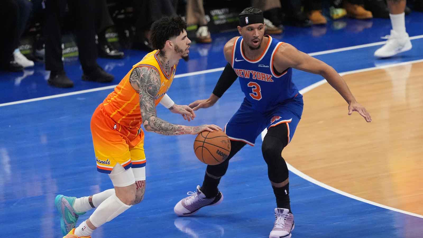 Charlotte Hornets guard LaMelo Ball (1) moves the ball against New York Knicks guard Josh Hart (3) during the first quarter at the Spectrum Center.