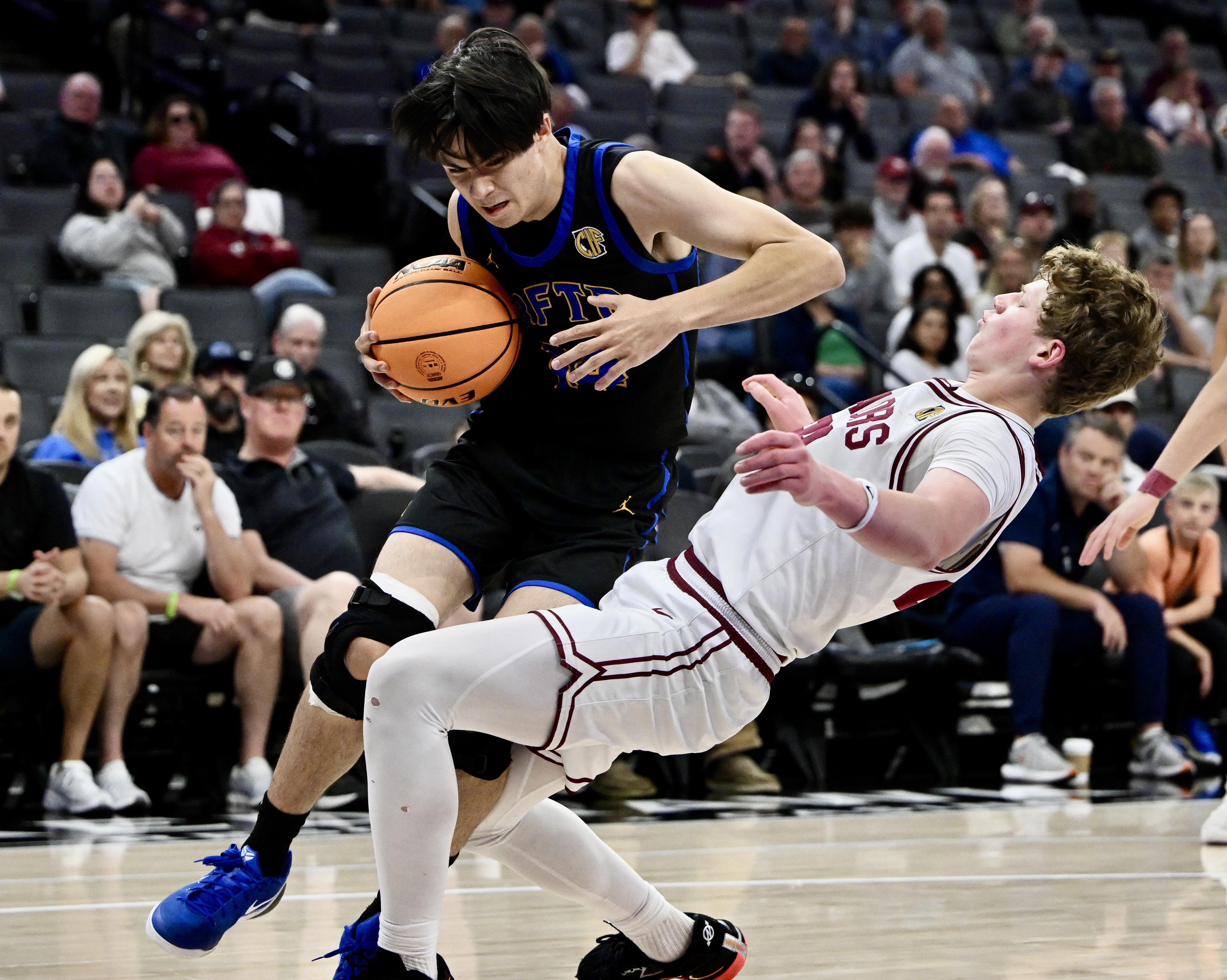 Cameron Goltara #14 of the San Juan Hills Stallions fouls...