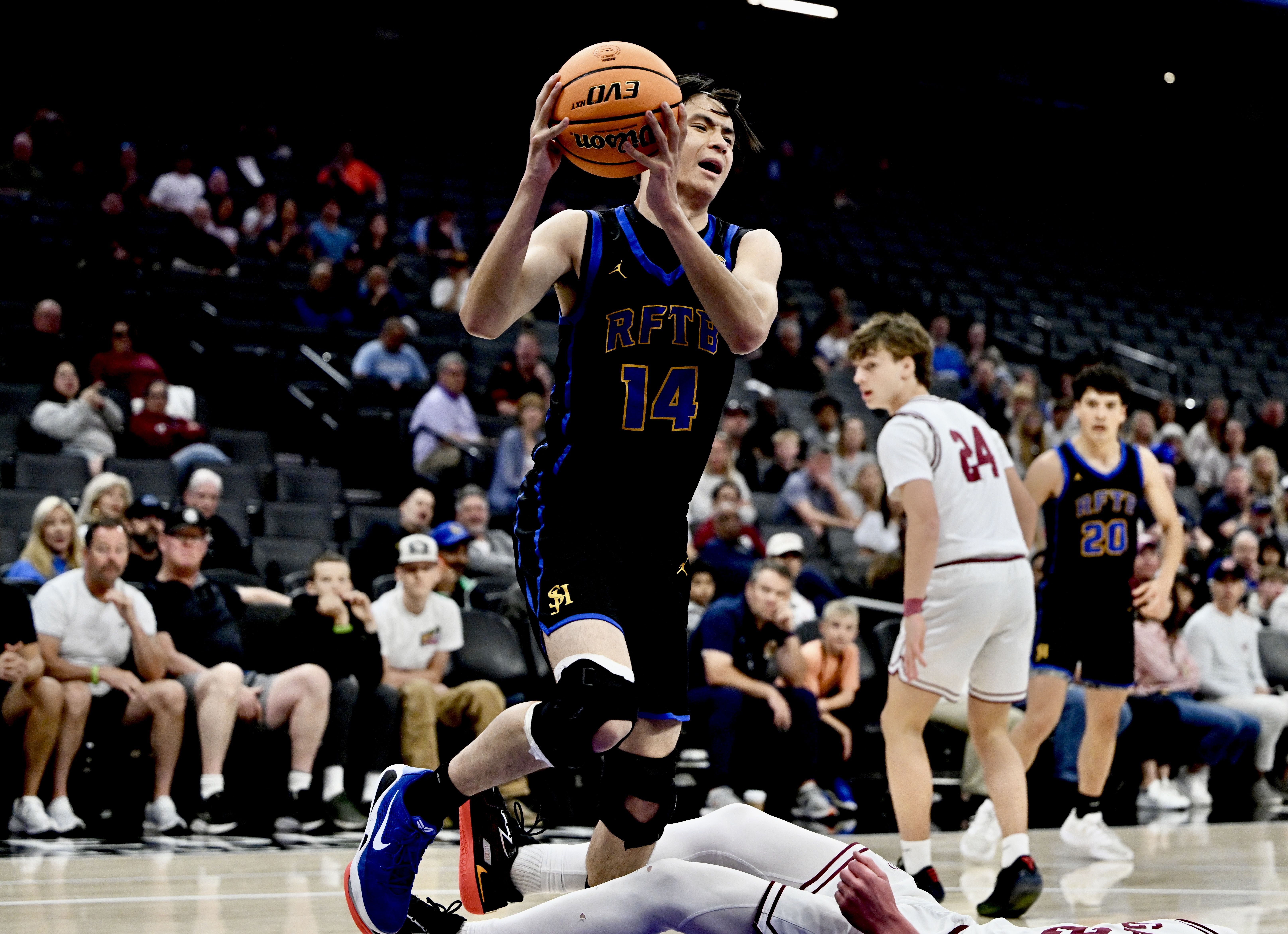 Cameron Goltara #14 of the San Juan Hills Stallions fouls...