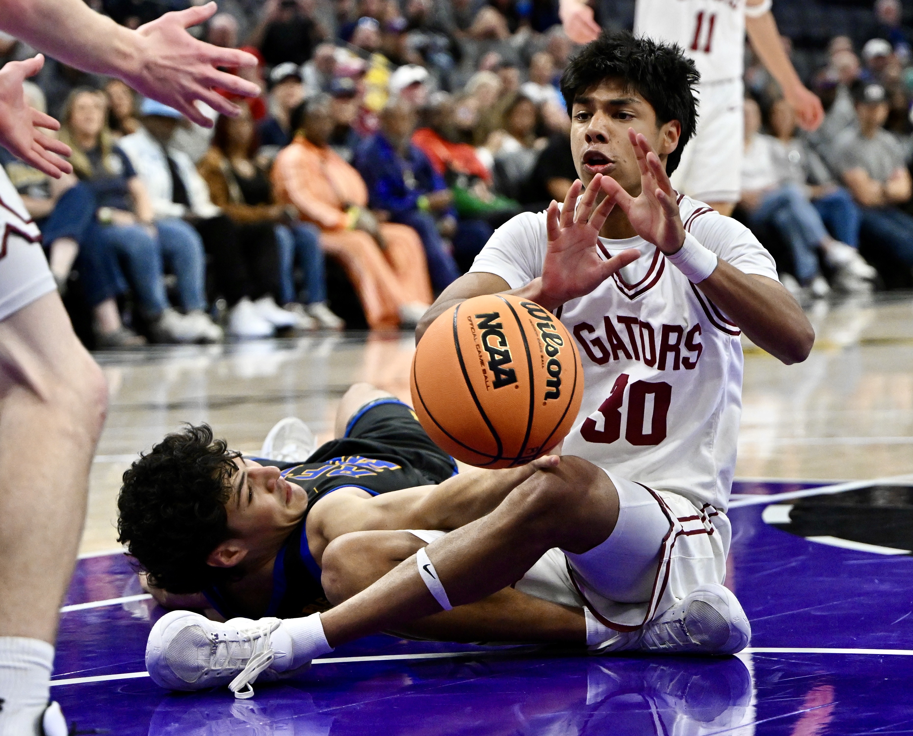 Garrett Brehmer #20 of the San Juan Hills Stallions scrambles...