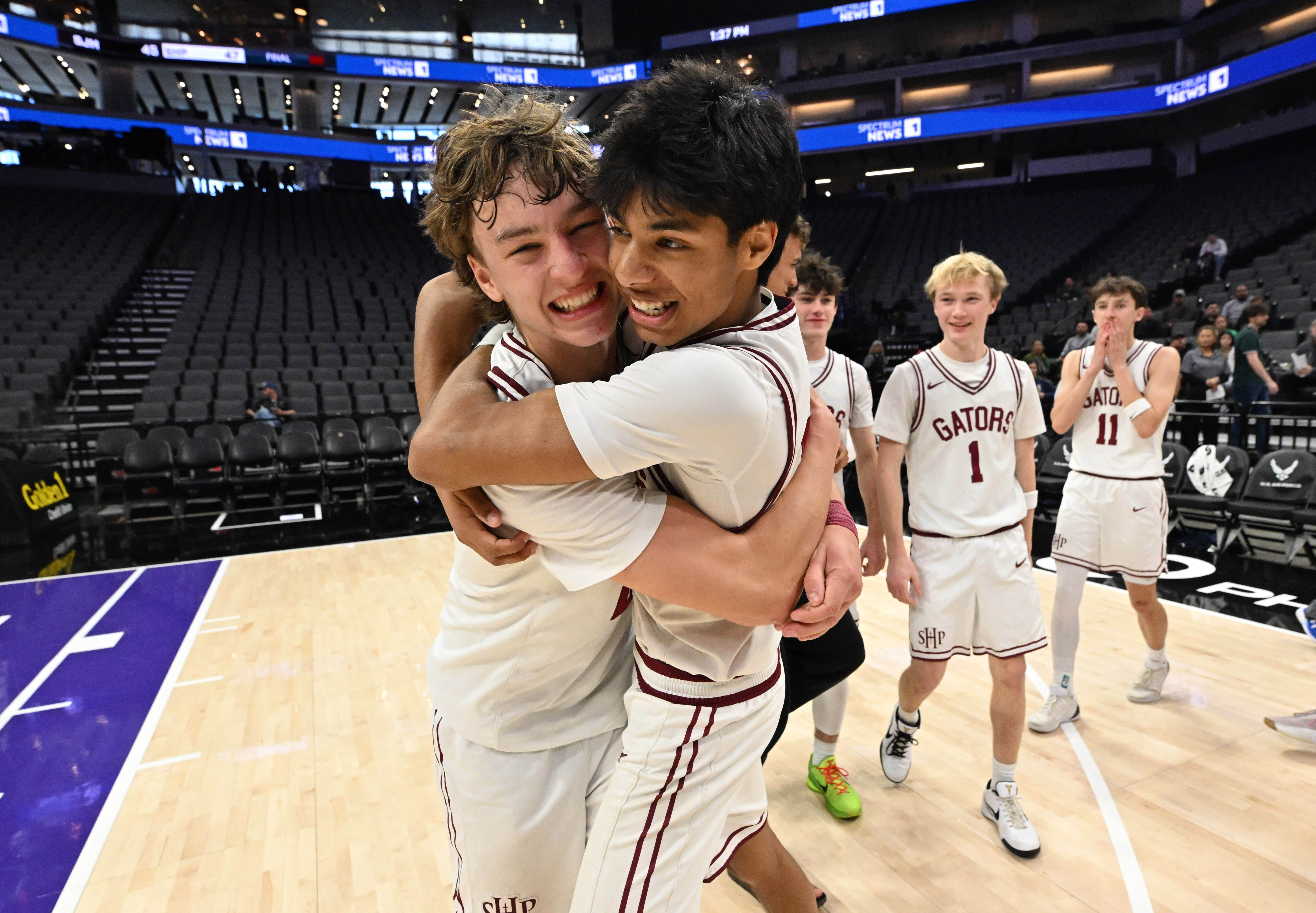 The Sacred Heart Prep Gators celebrate after defeating the San...