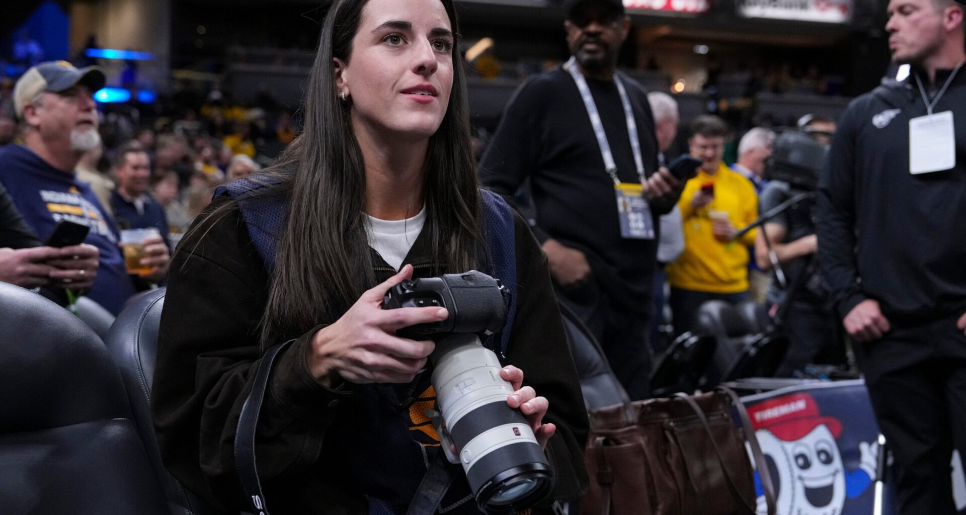 Caitlin Clark works as a photographer for the Indiana Pacers as they host LeBron and the Lakers