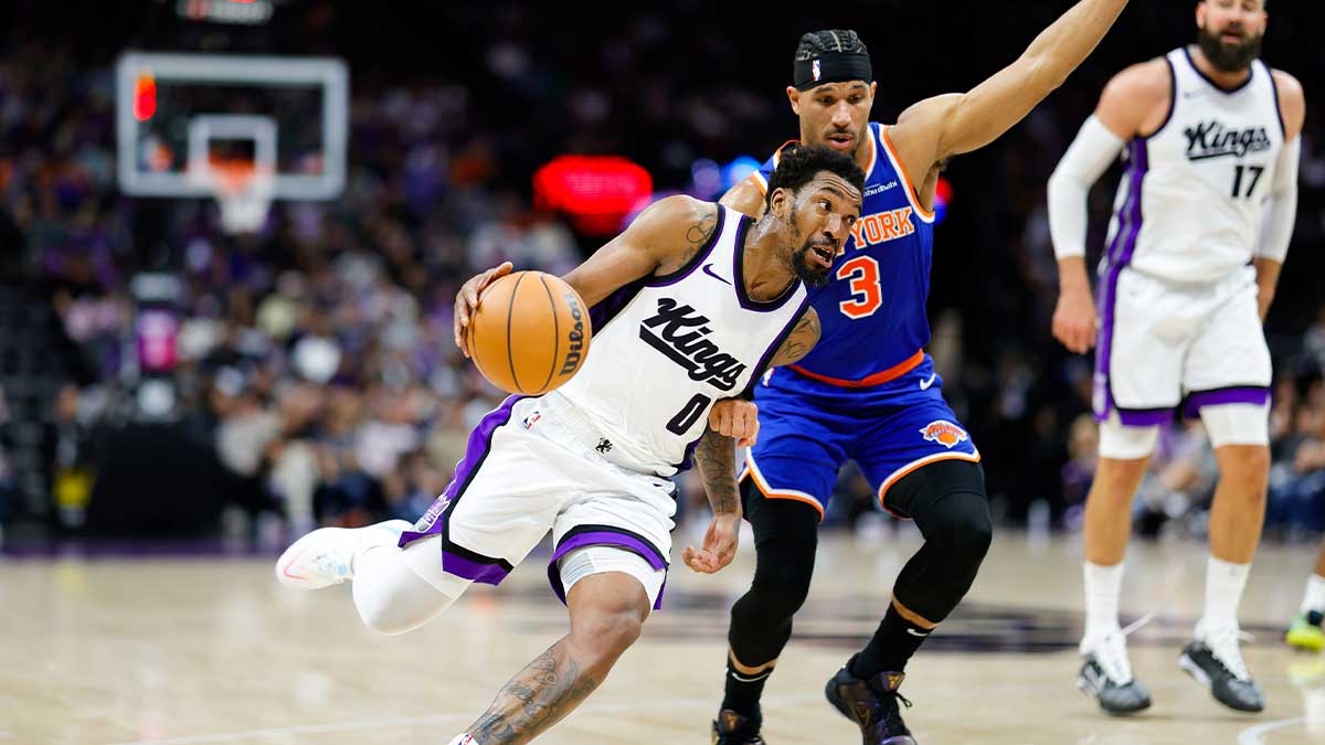 Sacramento Kings guard Malik Monk (0) dribbles the ball against New York Knicks guard Josh Hart (3) during the third quarter at Golden 1 Center.