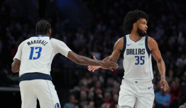 Marvin Bagley III (#35) and Naji Marshall (#13) of the Dallas Mavericks celebrate during a road game against the Portland Trail Blazers at Moda Center on March 27, 2026.